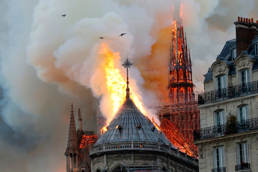 Smoke and flames rise during a fire at the landmark Notre-Dame Cathedral in central Paris on April 15, 2019, potentially involving renovation works being carried out at the site, the fire service said. (Photo by FRANCOIS GUILLOT / AFP)        (Photo credit should read FRANCOIS GUILLOT/AFP/Getty Images)
